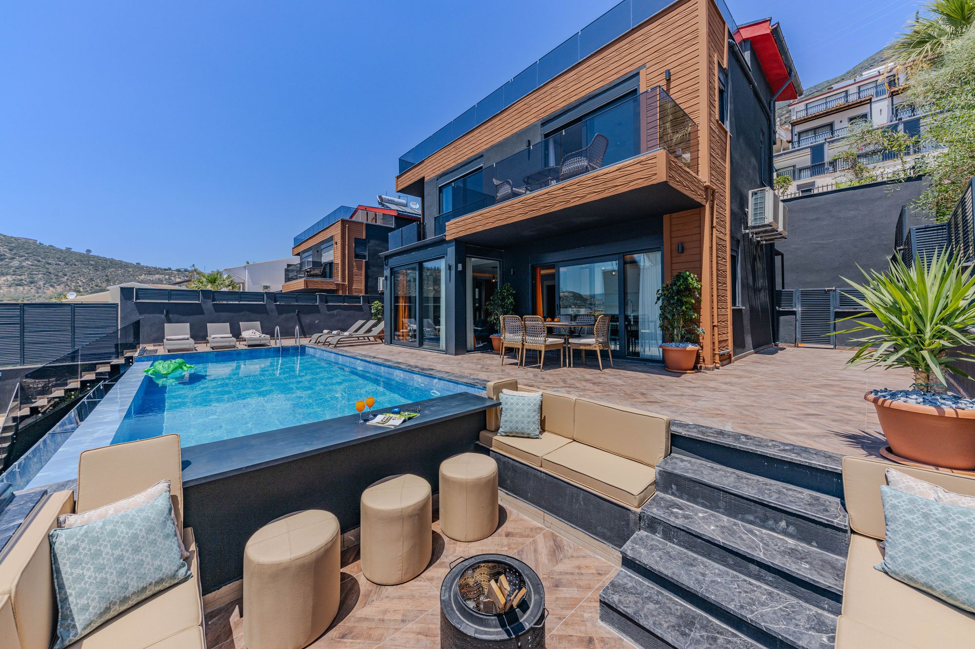 Clear residential swimming pool with an attached spa